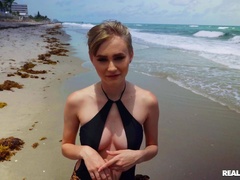 Glam cutie gives a dude a sudden blowjob at the seashore