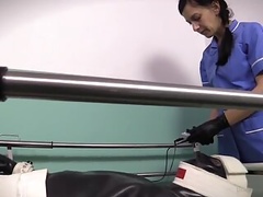 Charmer entices man in rubber and activates vibro rings on cock