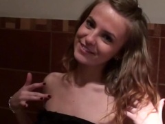 Slender amateur sucks two dicks for cash in the public toilet
