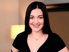 Cute-looking brunette April Valentino rides on a pretty big boner