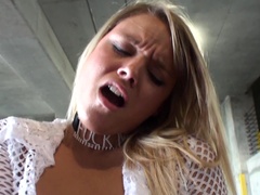 A blonde that poses naked outdoors is playing with herself