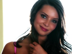 Beautiful Sally Charles plays with her shaved pussy