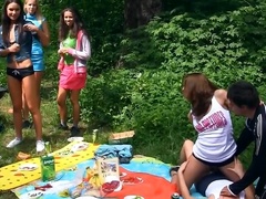 Naughty babes merge bodies and start touching pussies at picnic