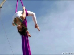 Hot brunette Bella Donna is showing some really exciting exercises outdoor