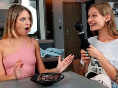 Rebecca Volpetti and Tiffany Tatum are playing with a toy