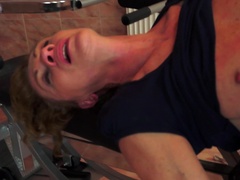 A nasty granny is getting her ass fingered in this video