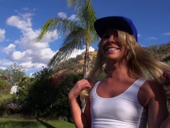 A hot blonde that loves exposing herself is making love outdoors