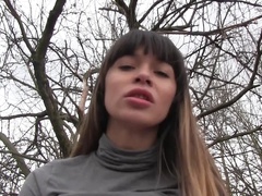 A lovely amateur is spreading her legs in the forest for her partner