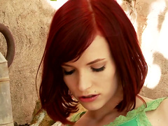 Alluring redhead Leila Smith outdoors