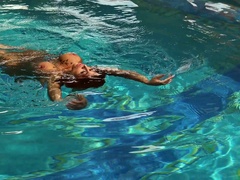 Hypnotizing mermaid Heidi Van Horny is masturbating pussy by the poolside