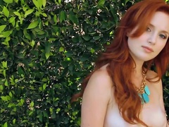 Molly Shaw the horny redhead girl lies naked on the lounge