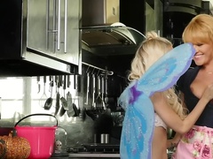 A blonde with nice big fake tits is with a hot teen, touching her